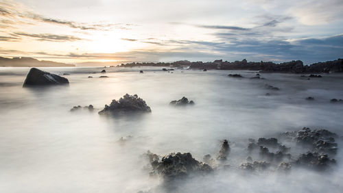 Scenic view of sea against dramatic sky