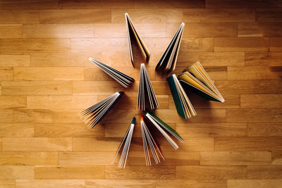 High angle view of umbrella on wooden floor