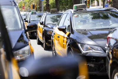 Taxi cabs in the city. 
ecological mobility in barcelona. waiting for tourists.