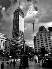 Low angle view of buildings in city against sky