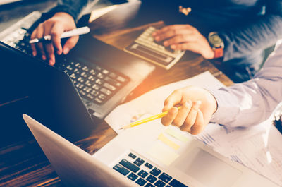 High angle view of business people working at table