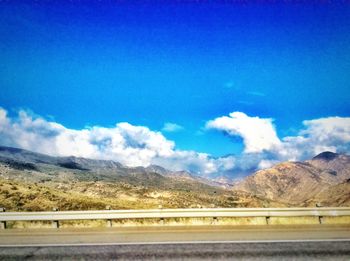 Scenic view of mountains against cloudy sky