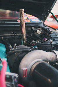 Close-up of vehicle engine in garage