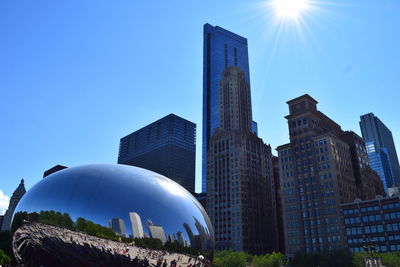 Low angle view of buildings against blue sky