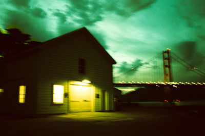 Illuminated building against sky at night