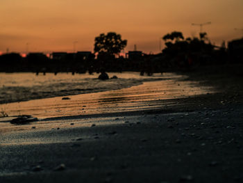 Scenic view of beach against sky during sunset