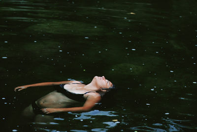 Woman swimming in water