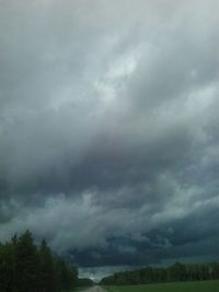 Scenic view of landscape against cloudy sky