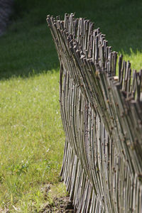 Close-up of wooden fence on field