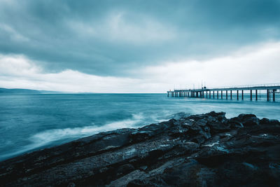 Scenic view of sea against cloudy sky