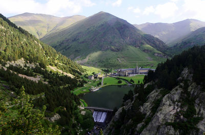 High angle view of bridge over mountains against sky