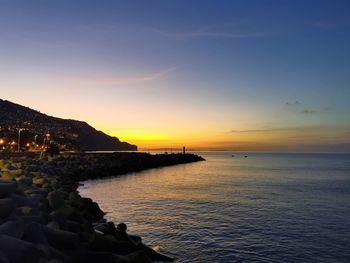 Scenic view of sea against sky during sunset