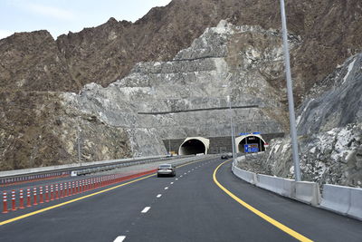 Car on road against mountain range