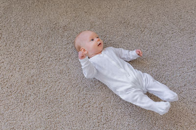 Side view of boy playing with toy on field