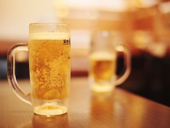 Close-up of beer glass on table