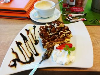 Close-up of cake served on table