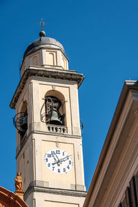 Low angle view of building against clear blue sky