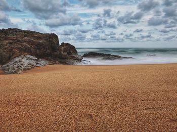 Scenic view of beach against sky