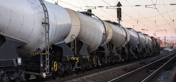 Train at railroad station against sky