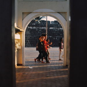 Full length of woman standing in tunnel