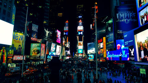 Illuminated city street at night