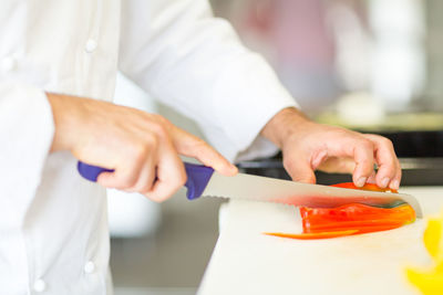 Close-up of chef preparing food