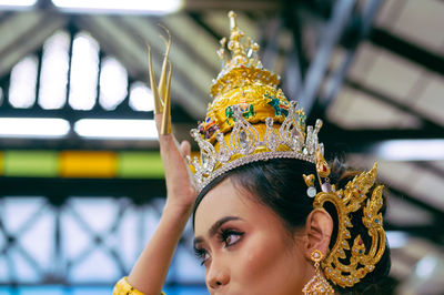 Close-up of woman wearing crown
