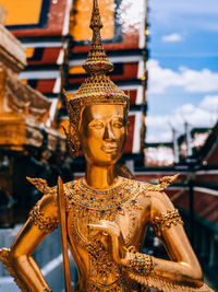 Close-up of statue against temple building