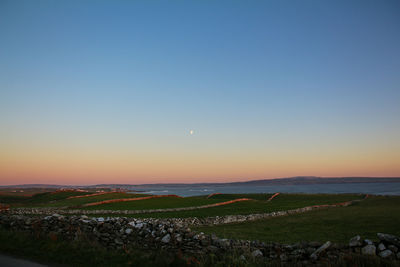 Scenic view of landscape against sky during sunset