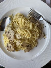 Truffles pasta on a plate from a parmesan wheel