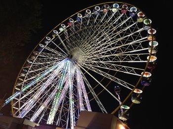 Low angle view of illuminated ferris wheel