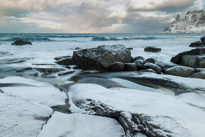 Scenic view of sea shore against sky