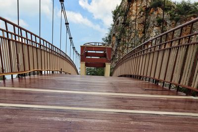 Bridge over road against sky