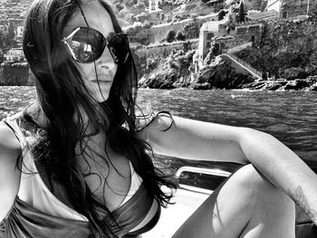 Portrait of young woman in sunglasses