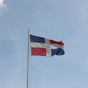 Low angle view of flag against sky