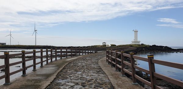 Pier over sea against sky