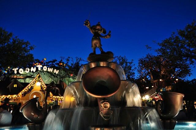 sculpture, statue, art and craft, human representation, art, illuminated, creativity, low angle view, fountain, sky, spirituality, night, blue, religion, architecture, dusk, lighting equipment, no people