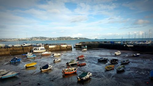 Boats moored at harbor