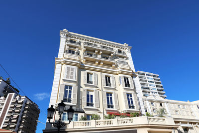Low angle view of building against clear blue sky