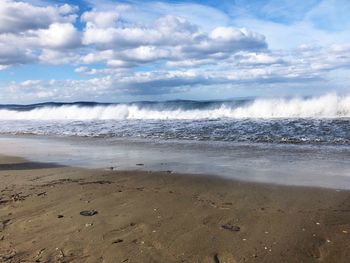 Scenic view of beach against sky