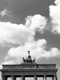 Low angle view of statue against cloudy sky