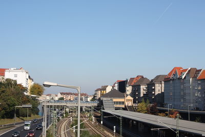 Cars on road against clear sky