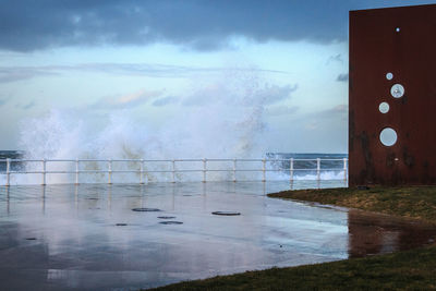 Wave splashing against wall in winter.