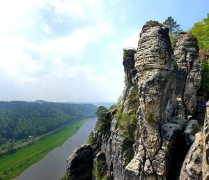 Panoramic view of rock formation on landscape against sky with river elbe