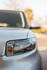 Close-up of car on road