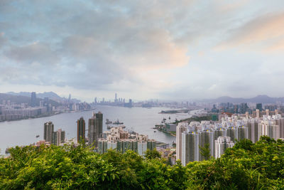 Panoramic view of city and buildings against sky