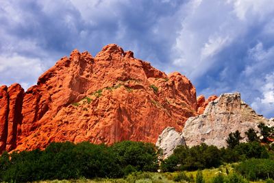 Low angle view of rock formation against sky