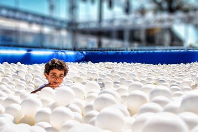 Portrait of boy in ball pool