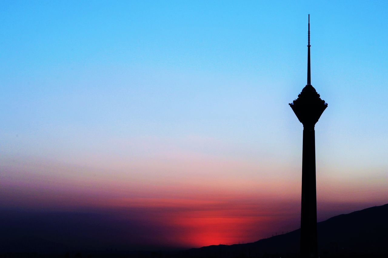 SILHOUETTE OF TOWER AGAINST CLEAR SKY