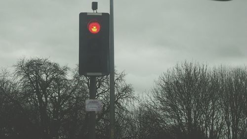 Low angle view of street light against sky